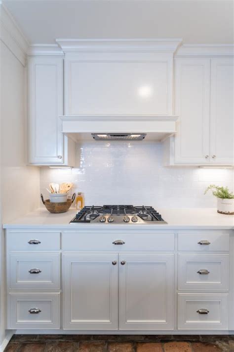 This backsplash tile can fit into many kitchen models. Modern White Kitchen with White Subway Tile Backsplash | HGTV