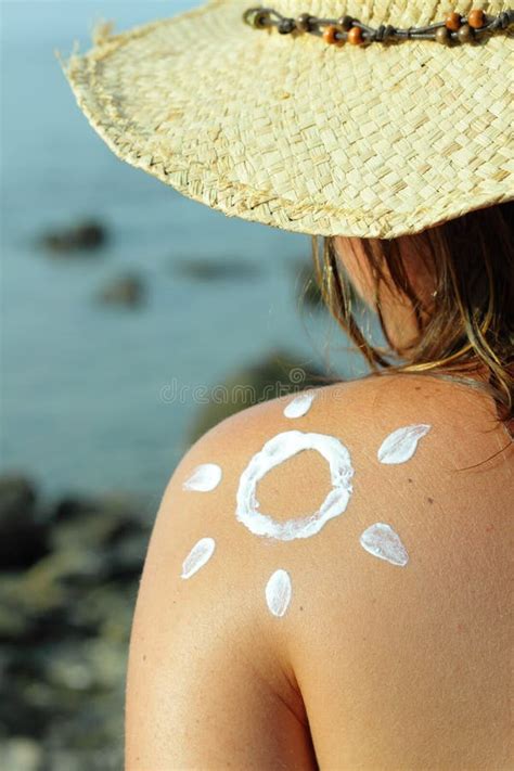 Suntan Lotion Woman In Bikini Apply Sun Protection Cream On Her Smooth Tanned Legs Skin Care