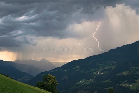 Dramatic Sky With Thunderstorm And Lightning Bolt In The Mountains At