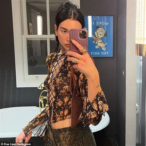 Dua Lipa Turns Up The Heat As She Flaunts Her Cleavage In A Racy Tie Up Top And