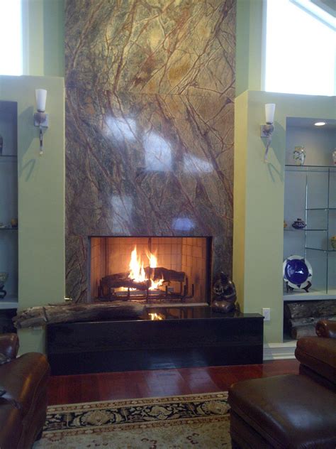 It will provide a gathering point for nights out, and make a marvelous focal point in your home. Granite Fireplace Surround. Different stone and gas but I like the idea | Fireplace surrounds ...