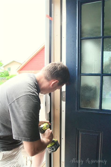 The cassette is installed horizontally over the doorway. Flies No More {Retractable Screen Door} - Stacy Risenmay