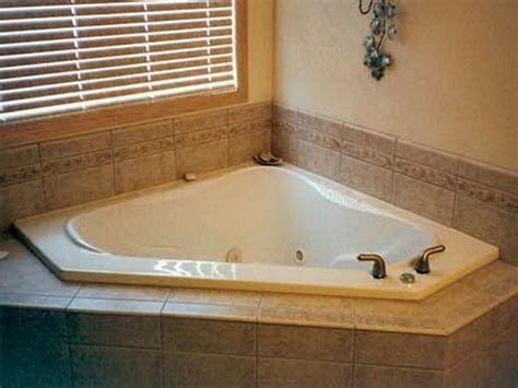 Attach a straight board to the backer board along the line. Bathroom Tub Tile Ideas | Vizimac | Corner tub, Tile around bathtub, Corner jacuzzi tub
