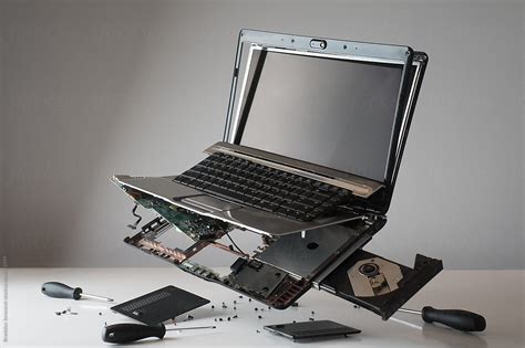 Broken Laptop Computer Floating By Stocksy Contributor B Krokodil