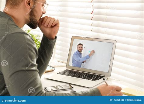 Young Man Watching Video At Desk Online Learning Stock Image Image