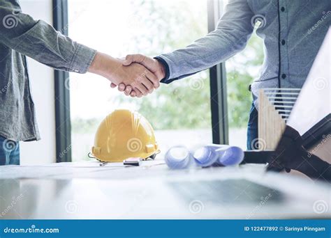 Engineer Handshake Meeting For Architectural Project And Working Stock