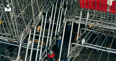A Row Of Shopping Carts With Blue Handles Photo Free Shopping Cart