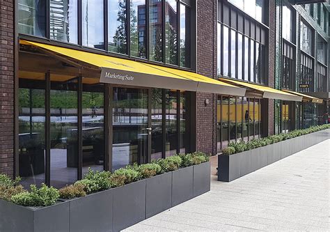 Sq2 Awnings With Bespoke Encasement For Darbys At Embassy Gardens