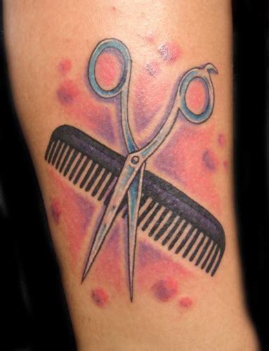 Small Comb And Scissor Tattoo On Shoulder