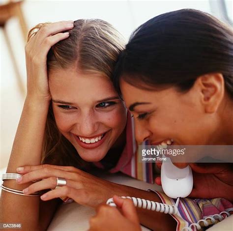 two women talking on phone photos and premium high res pictures getty images