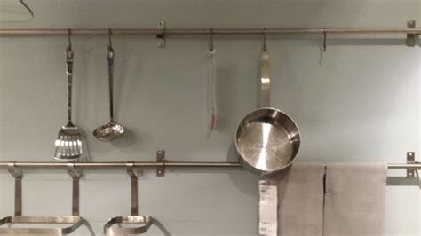 Use a towel rail designed for a bathroom. hanging the pots and pans instead of putting it in a ...