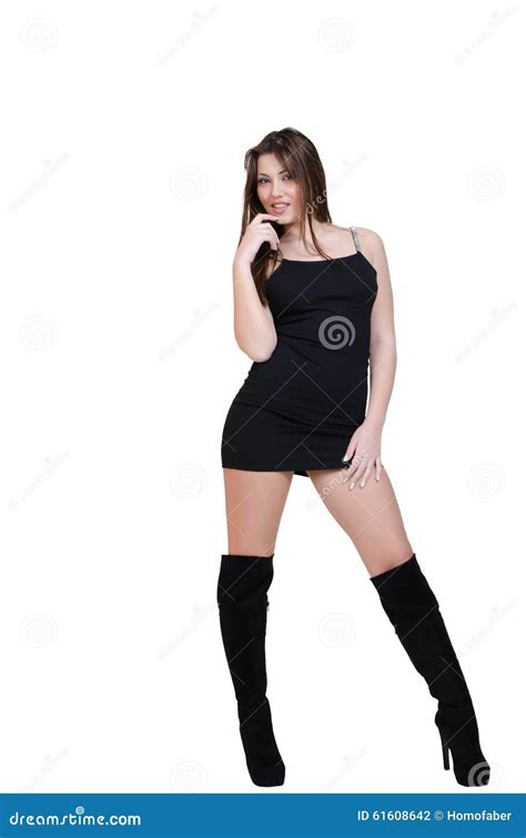 Babeface Female Posing In The Studio Dressed In Black Dress Stock Photo