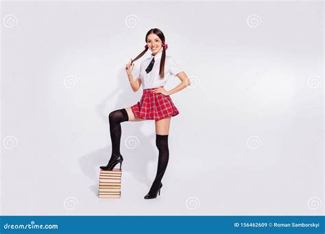 full length side profile body size photo beautiful she her teacher stand leg book pile diligent