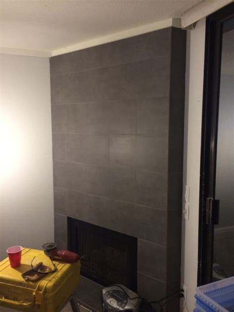 Fires and wood burners tend to give off a warm glow, which would really help to accentuate the texture on your tiles; 12" x 24" porcelain tile on fireplace wall and hearth - Yelp