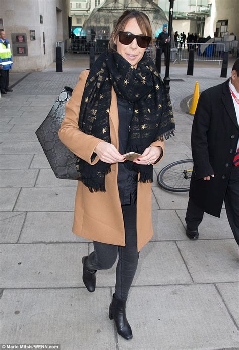 Alex Jones Covers Up Her Baby Bump In A Chic Winter Coat As She Leaves