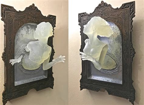 you can now get a super creepy ghost in the mirror wall plaque that glows in the dark