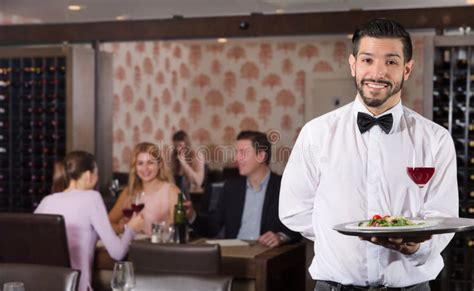 Waiter Holding Tray At Restaurant With Customers Stock Image Image Of