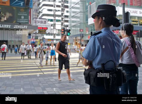 Hong Kong Police Woman Patrolling On Street 25 Aug 2012 Stock Photo