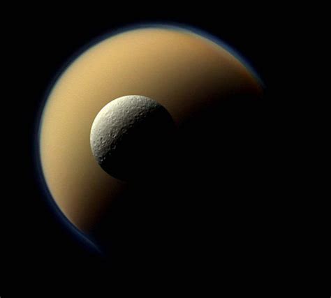 Saturns Moon Rhea Hovering In Front Of Saturns Largest Moon Titan