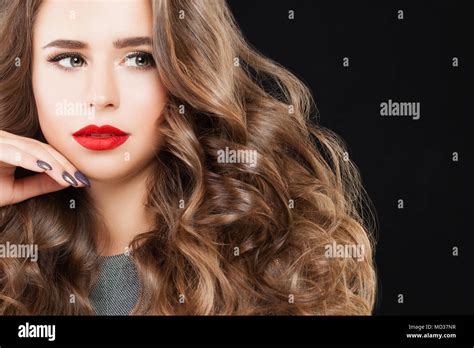 Nice Model Woman With Long Wavy Hair Perfect Makeup And Manicured Hand Beautiful Girl With Red