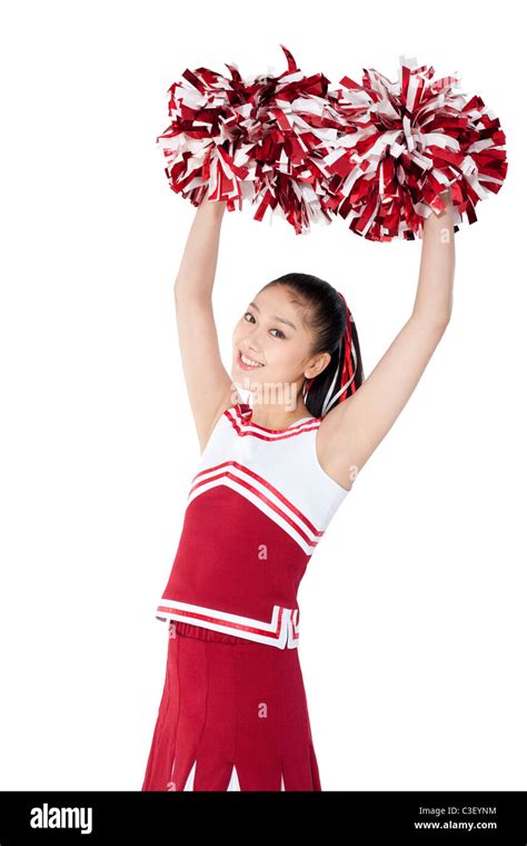 Cheerleader In Action With Her Pom Poms Stock Photo Alamy