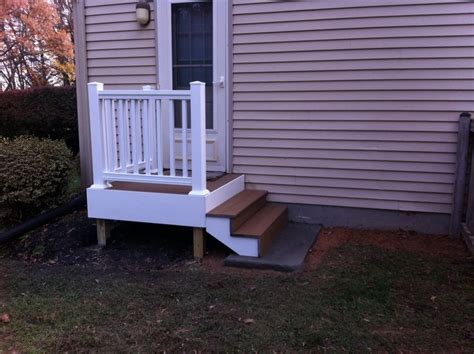Back Door Steps With Landing Composite Decking And White Vinyl