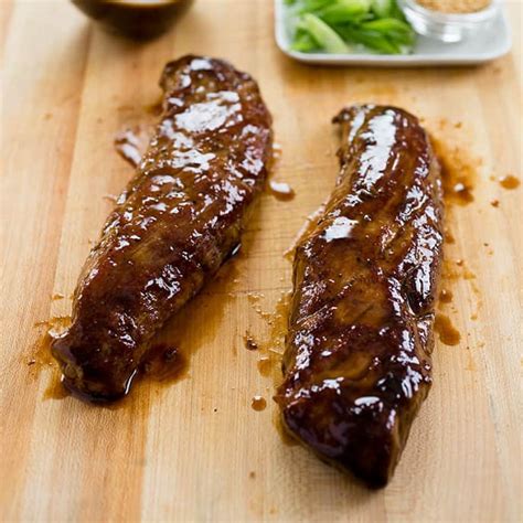 Tying the smaller end of the tenderloin under helps the meat cook evenly. Hoisin-Glazed Pork Tenderloin | Cook's Country