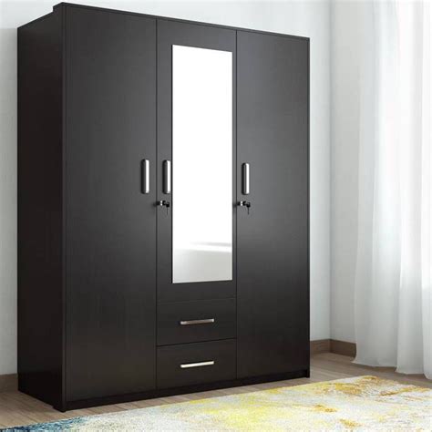 The wardrobe has three doors with the central door featuring a full length mirror. Value 3 Door Dresser Wardrobe with Mirror - Spacewood Online