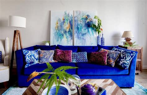 Blues also pop well against wood materials and metallic finishes. Eclectic cozy living room decor with navy blue sofa # ...