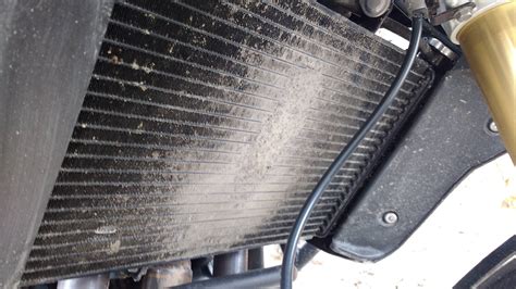 It does not matter how clogged you think your radiator is, you can clean it with a mixture of vinegar and baking soda. Cleaning mud from motorcycle radiator - Motor Vehicle ...