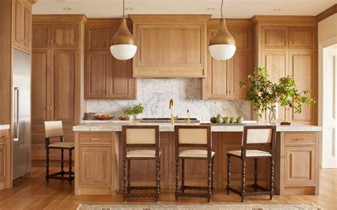 Use a safe method that won't harm the surface of stained wood kitchen cabinets to restore their shine. light stained kitchen cabinets with wood floors - Google ...