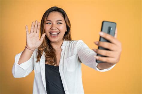 Asian Woman Holding A Smart Phone For Selfie Or Video Call Stock Image