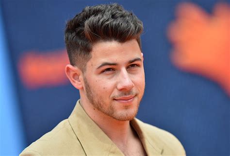 nick jonas shares a throwback picture flaunting his imaginary bicep bulge masala