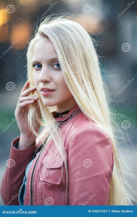Young Beautiful Blond Woman Portrait With Wind In Her Hair Stock Photo