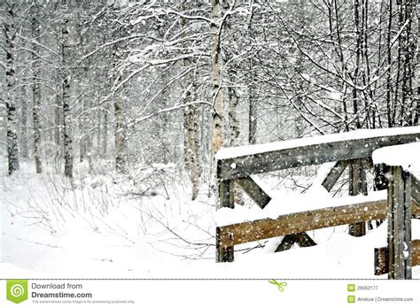 Snowy Winter Scene With A Wooden Bridge Stock Image