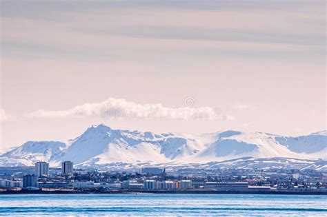 City Seascape Of Reykjavik With Mountains In The Background Editorial