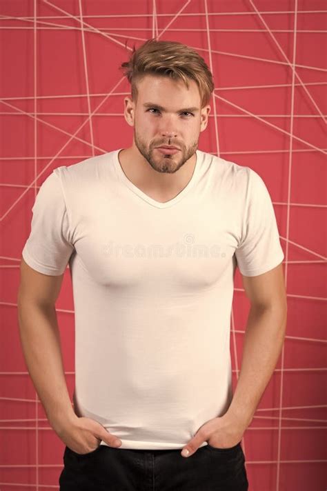 man in the white tshirt with copy space standing on pink wall background stock image image of