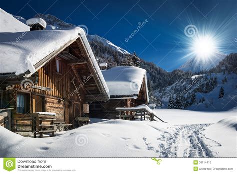 Winter Ski Chalet And Cabin In Snow Mountain Stock Photo