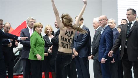 putin visibly amused by topless femen protest in germany der spiegel