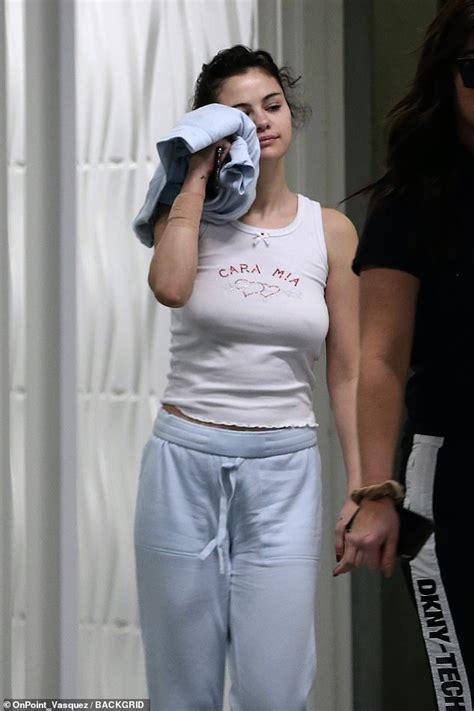 Selena Gomez Goes Braless In White Tank Top And Sweatpants As She Visits Office Building With