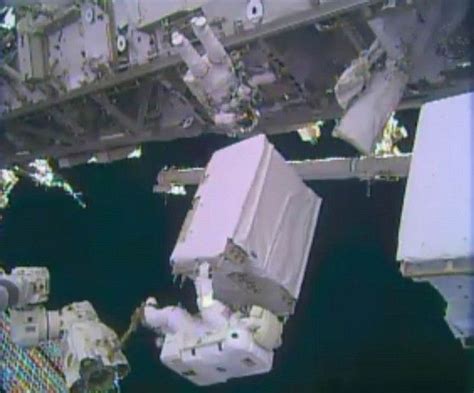 Nasa Astronaut Mike Hopkins Holds A Spare Ammonia Pump Module During A