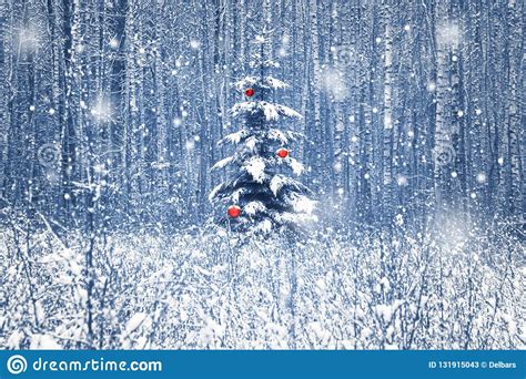 Christmas Fir Tree With Red Christmas Decorations In The Winter Snowy