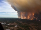 Chuckegg Creek wildfire burns out of control in Alberta, Canada ...