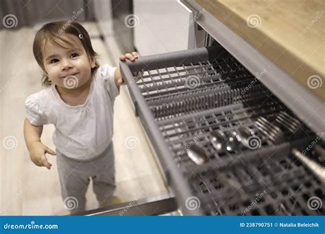 Little Cute Toddler Girl Helping To Unload Dishwasher Funny Little