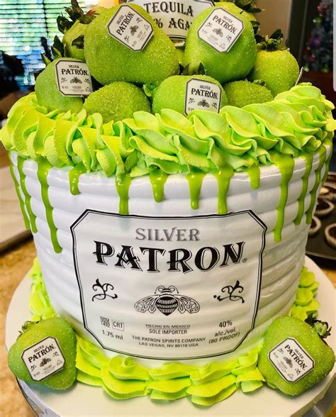 patron silver and green chocolate dripped cake with chocolate covered strawberries all a s