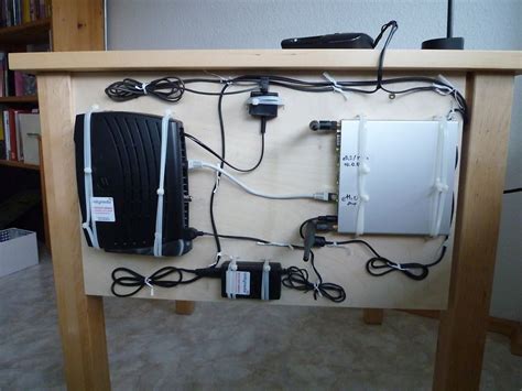 Edison sent one of his electricians to run the wires under the floor. Decluttering wires. A peg board behind the table ...
