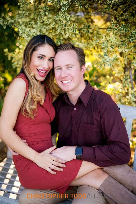 Maybe you would like to learn more about one of these? newly engaged couple portrait wearing burgundy outfits and ...