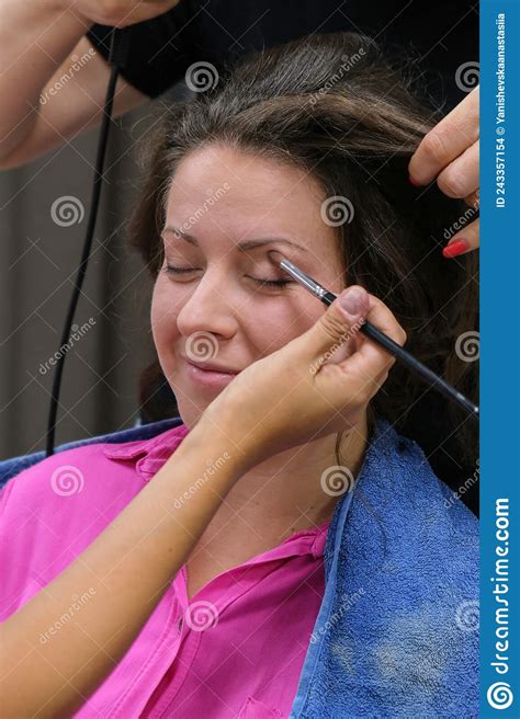 Makeup Artist Apply Makeup On The Eyes Of Young Woman Professional
