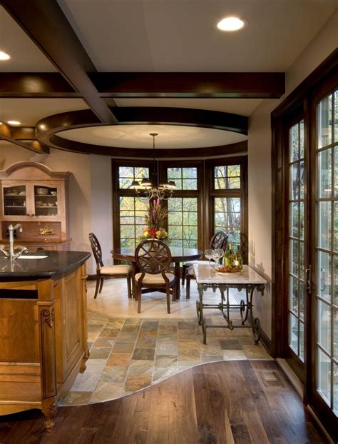 Hardwood and tile floor in residential home kitchen and dining. 4 Ways And 41 Examples To Ease The Floor Transition - DigsDigs
