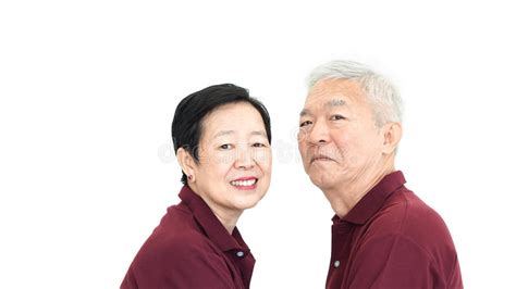 Happy Asian Senior Couple On White Background Love And Hug Stock Photo